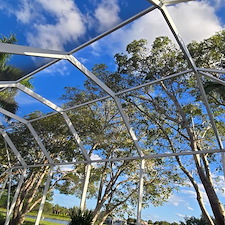 Pressure-washing-of-lanai-located-in-Bellagio-Community-in-Lake-Worth-FL-33467 1